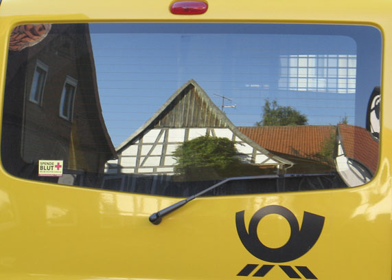 Mein Haus im Postauto . my house in the postcar